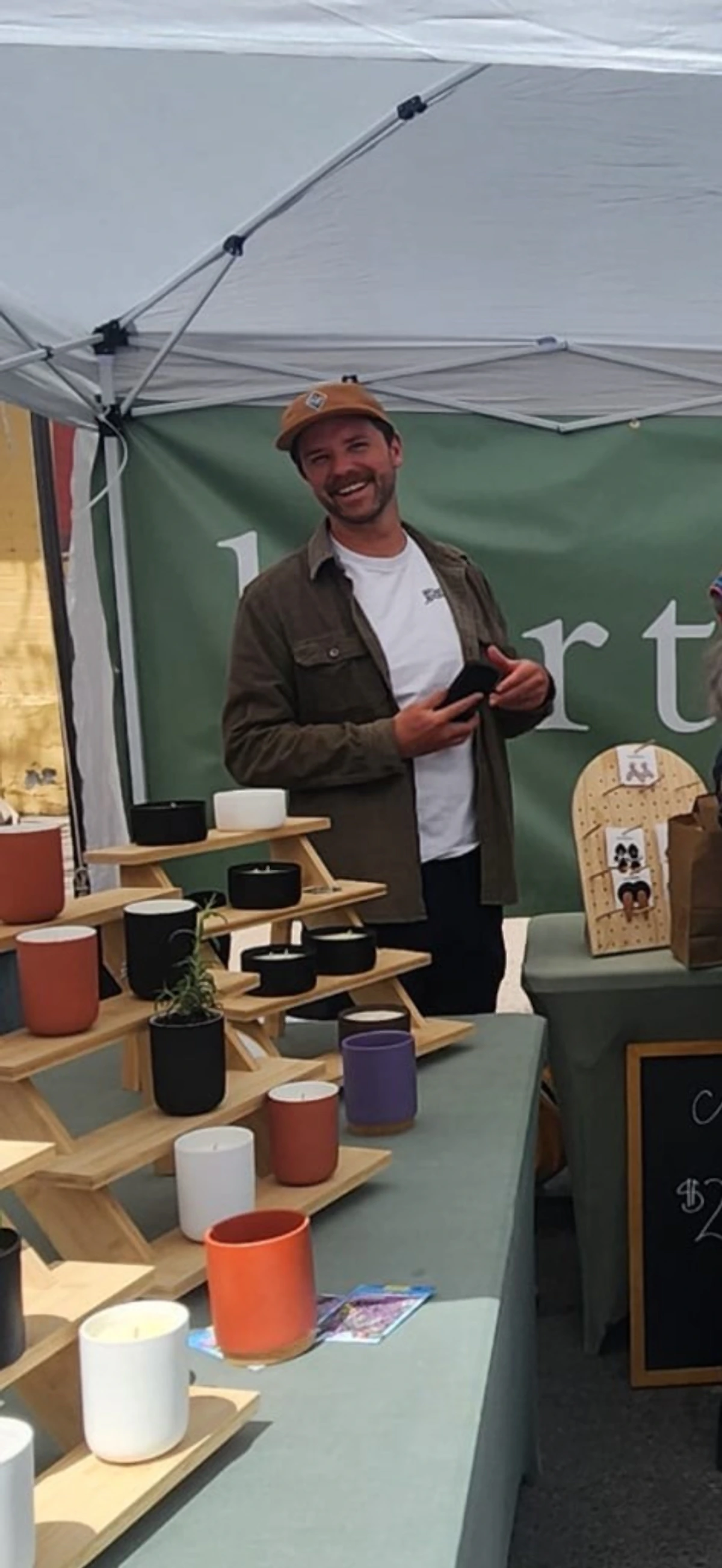 Joey at the Hartisans table of handmade Durango candles